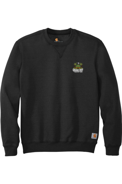 Front view of a black crewneck sweatshirt laid flat. A small, embroidered logo for "Cheba Hut Toasted Subs," featuring a tiki hut and palm trees, is on the upper left chest.