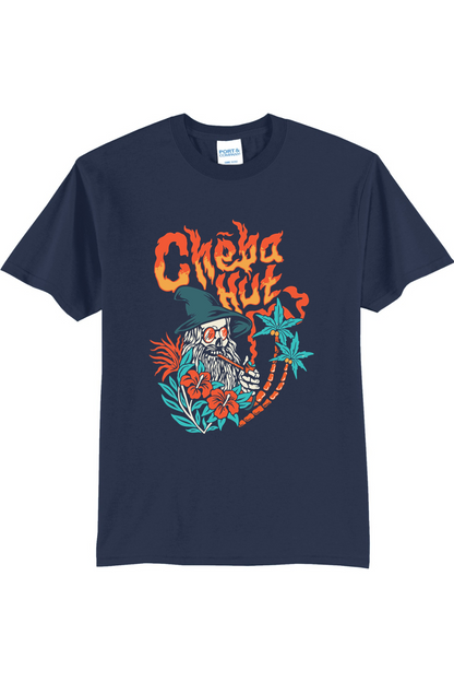 A navy short-sleeved t-shirt featuring a colorful graphic on the back depicting a wizard-like figure with a long white beard, a pointed hat, sunglasses, and a pipe, surrounded by flames, hibiscus flowers, and palm trees, with the 'Cheba Hut' logo above.